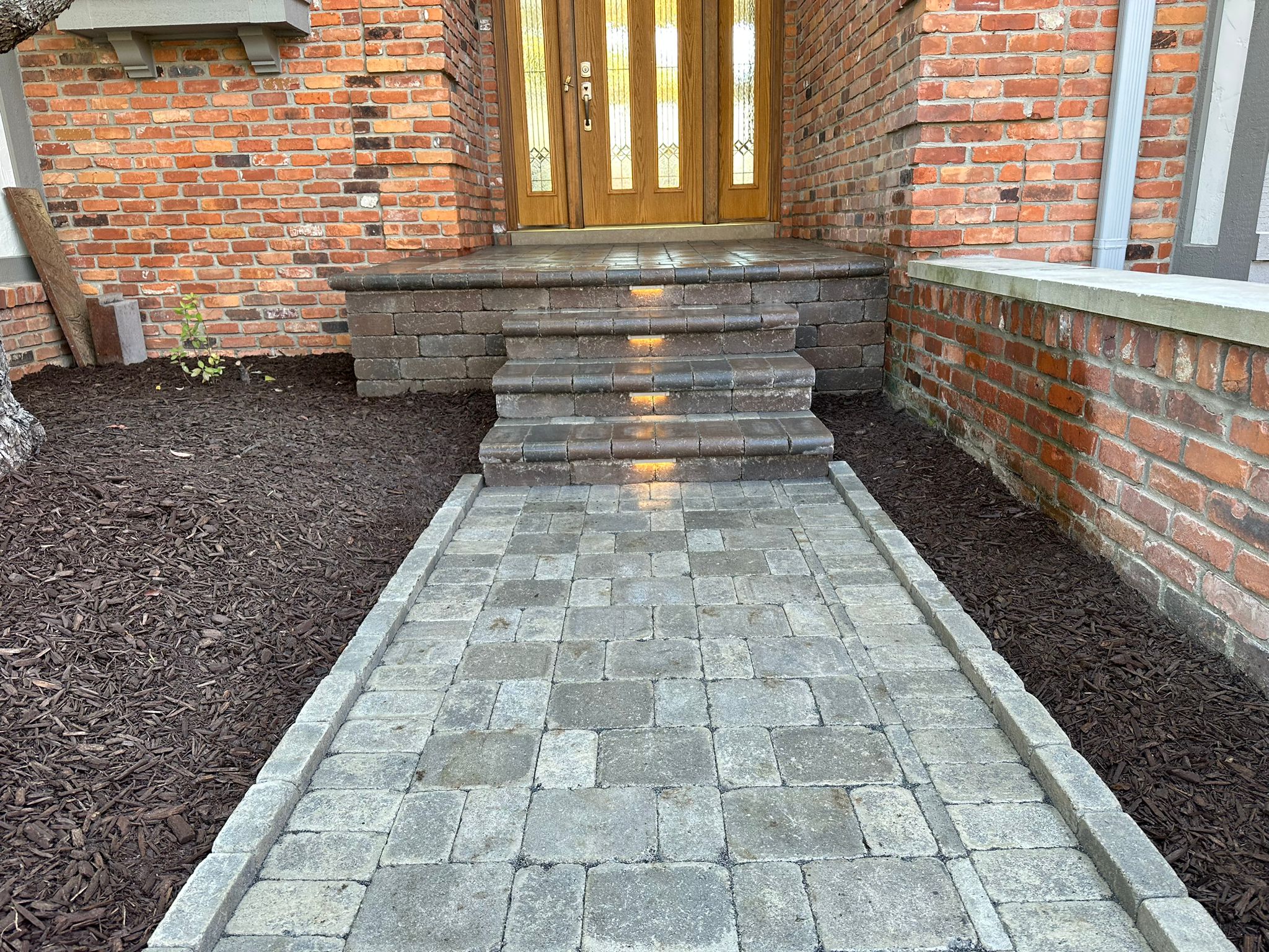 Elegant front entrance pathway with plants